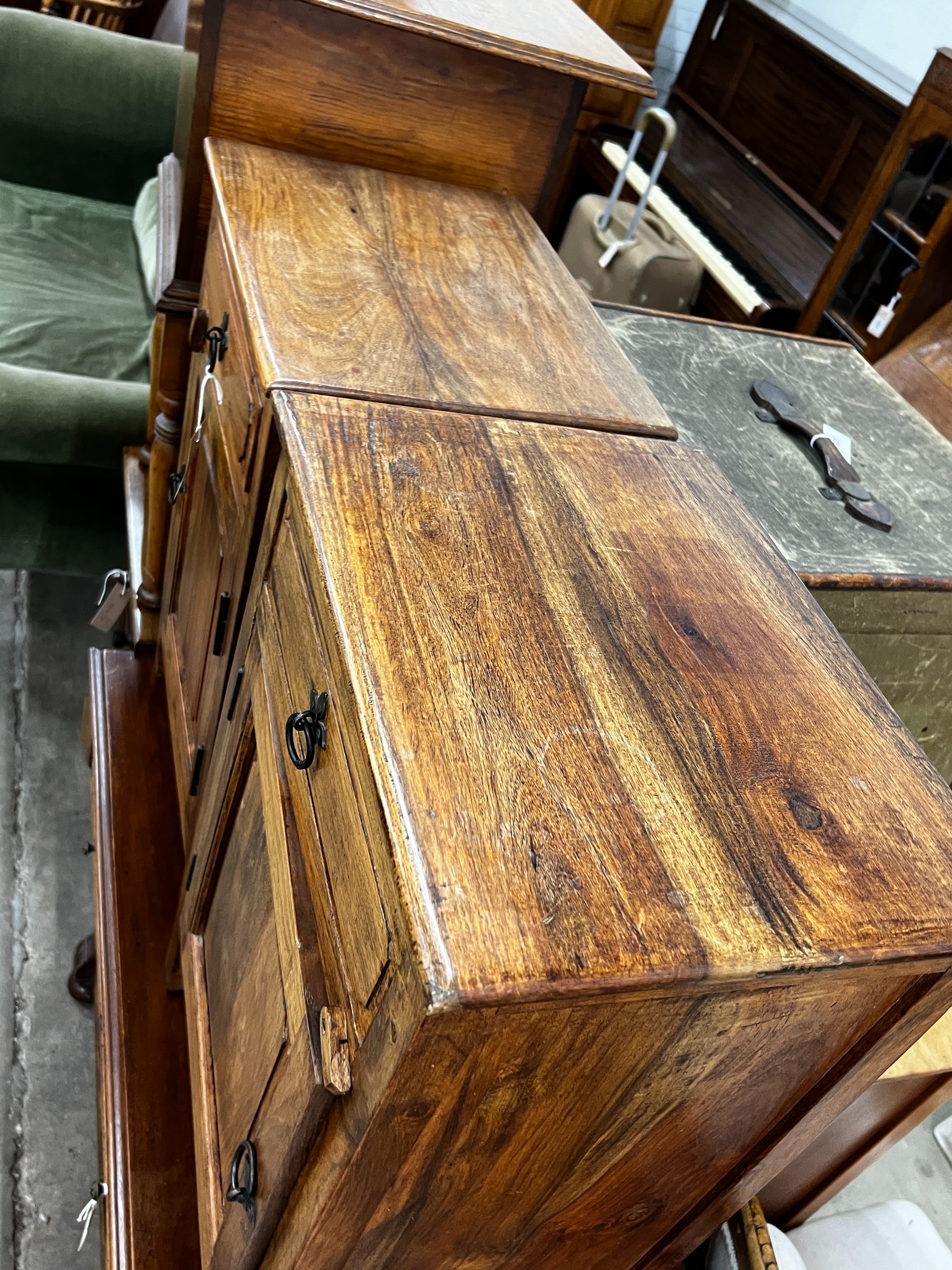 A pair of Indonesian hardwood bedside cabinets, width 43cm, depth 31cm, height 64cm